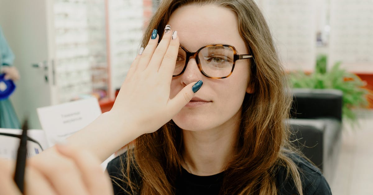 How can I choose my time of visit to avoid the crowds at the Paris Catacombs? - Crop oculist covering eye of woman How can I choose my time of visit to avoid the crowds at the Paris Catacombs? - Crop oculist covering eye of woman