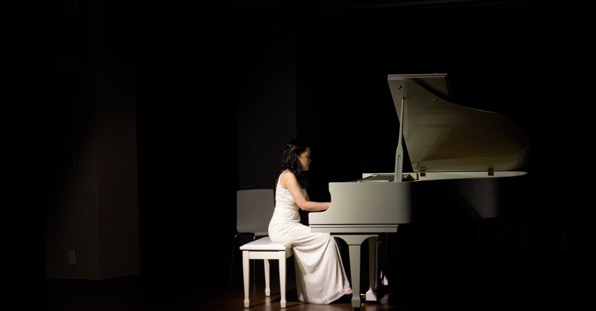 How can I find a performance of Mozart's Piano Concerto No. 20 in D minor? - Woman Playing Grand Piano How can I find a performance of Mozart's Piano Concerto No. 20 in D minor? - Woman Playing Grand Piano