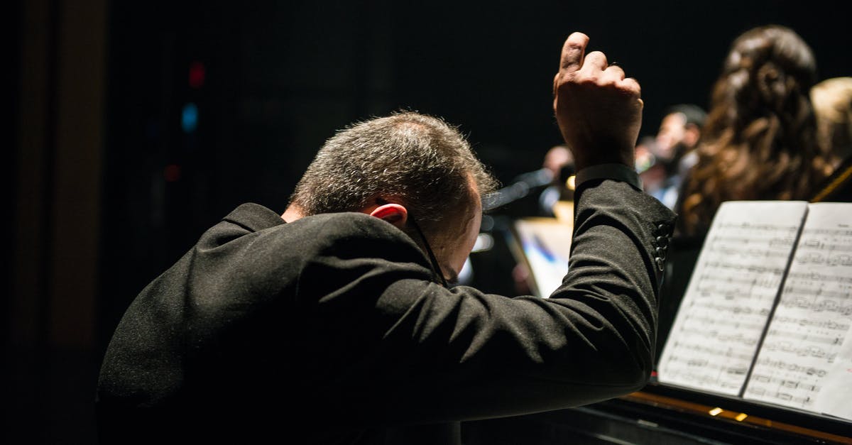 How can I find a performance of Mozart's Piano Concerto No. 20 in D minor? - Conductor Sitting in Front of Songbook How can I find a performance of Mozart's Piano Concerto No. 20 in D minor? - Conductor Sitting in Front of Songbook