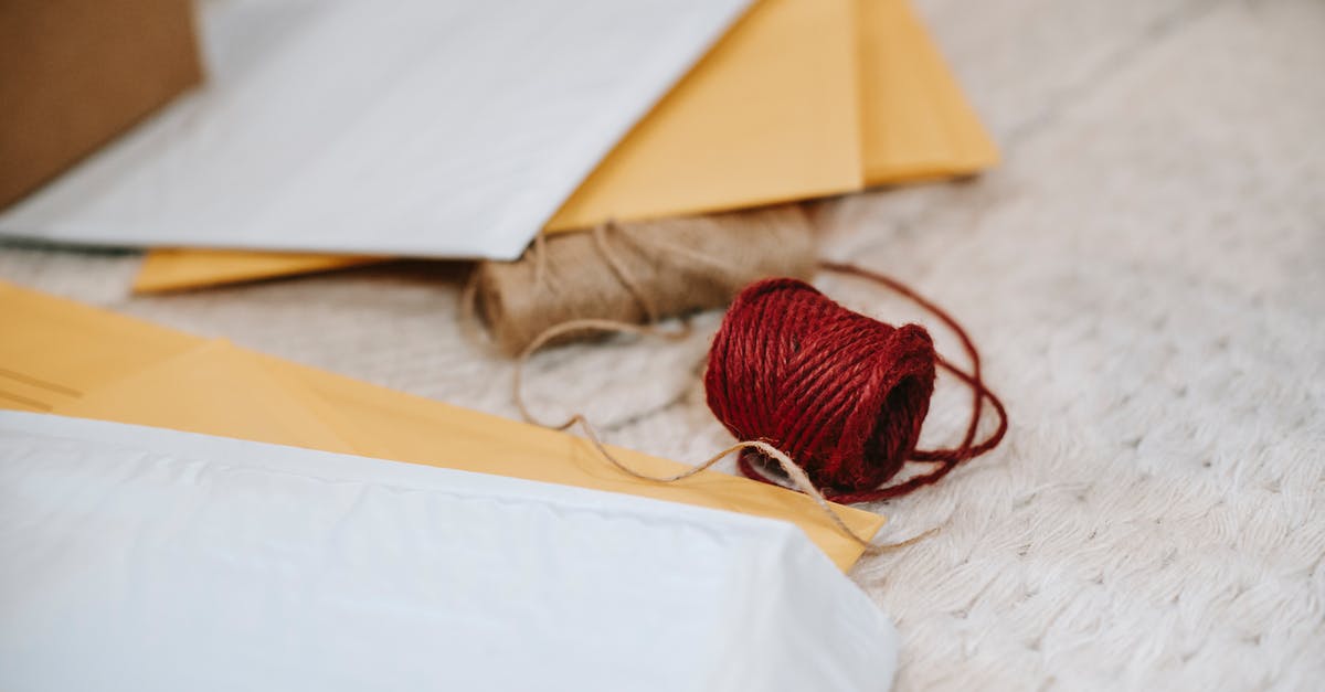 How can I find out how many Miles I will receive on Royal Plus? - Woolen red and beige twine thread bobbins among envelopes How can I find out how many Miles I will receive on Royal Plus? - Woolen red and beige twine thread bobbins among envelopes