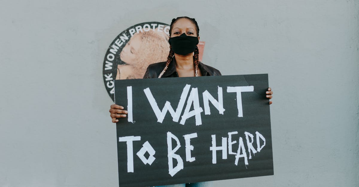 How can I find out if I'm wanted in Turkey? - Woman in Black Sunglasses and Blue Denim Jeans Standing Beside Wall With Black and White Kanji How can I find out if I'm wanted in Turkey? - Woman in Black Sunglasses and Blue Denim Jeans Standing Beside Wall With Black and White Kanji