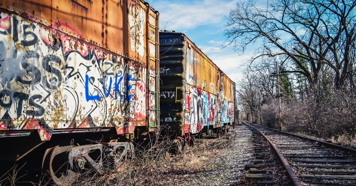 How can I find out what type of train is used for a Shinkansen service? - Old railway carriages with graffiti on surface under cloudy sky How can I find out what type of train is used for a Shinkansen service? - Old railway carriages with graffiti on surface under cloudy sky