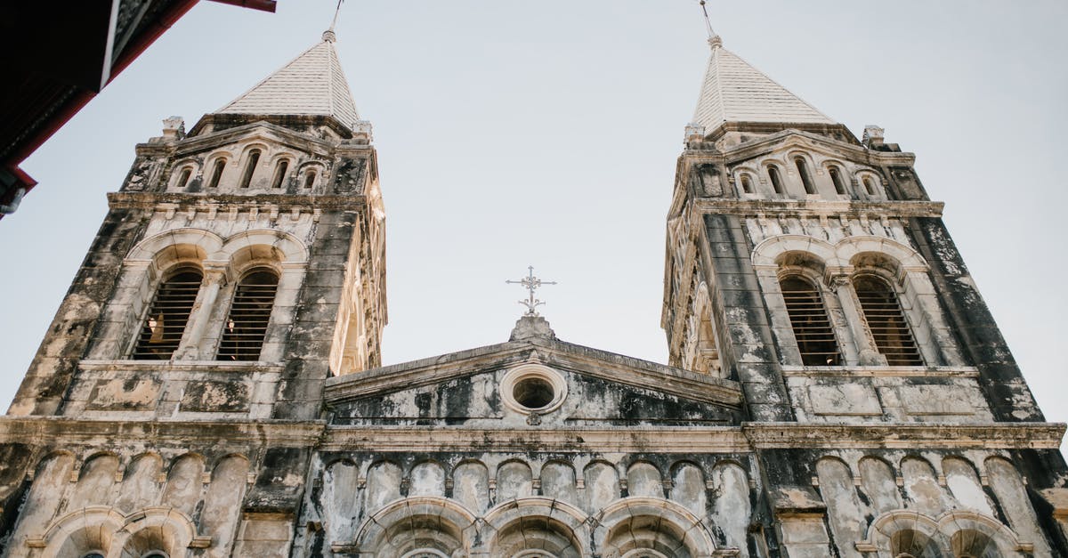 How can I find the cheapest Spirit flight from my location to anywhere? - From below of shabby exterior of ancient historic church against blue sky in city How can I find the cheapest Spirit flight from my location to anywhere? - From below of shabby exterior of ancient historic church against blue sky in city