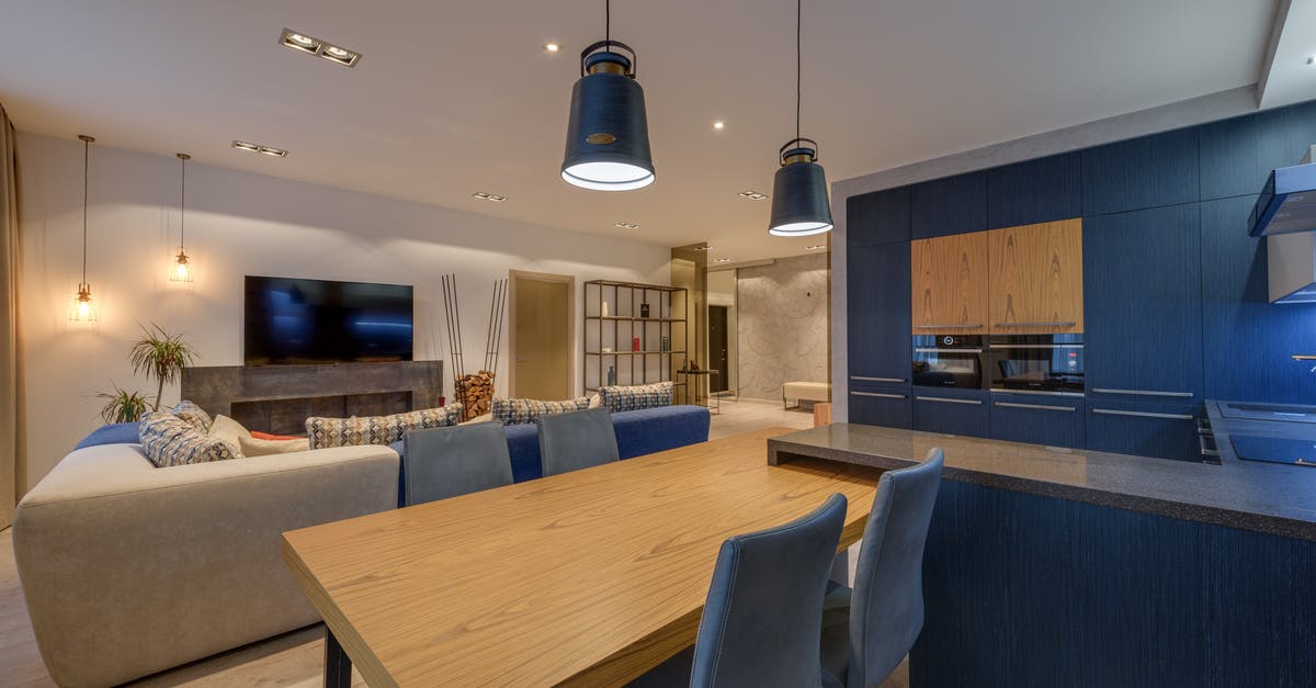 How can I get a different seat after boarding a flight? - Interior of modern lounge with kitchen illuminated with lamps in comfortable spacious apartment How can I get a different seat after boarding a flight? - Interior of modern lounge with kitchen illuminated with lamps in comfortable spacious apartment
