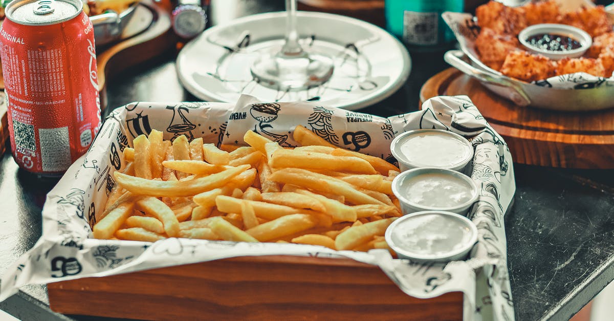 How can I get to Cacao, French Guiana? - A Fries with Dips on a Wooden Tray Near the Red Can How can I get to Cacao, French Guiana? - A Fries with Dips on a Wooden Tray Near the Red Can