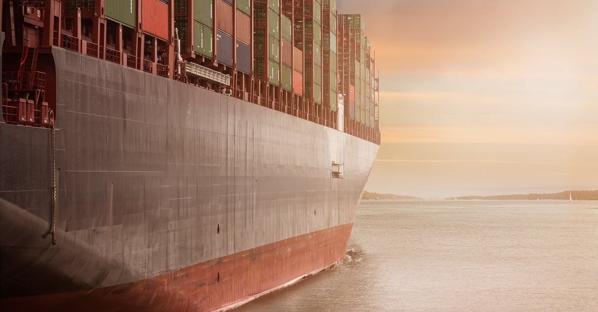 How can I get to Iceland on a cargo ship? - Boat in Body of Water How can I get to Iceland on a cargo ship? - Boat in Body of Water