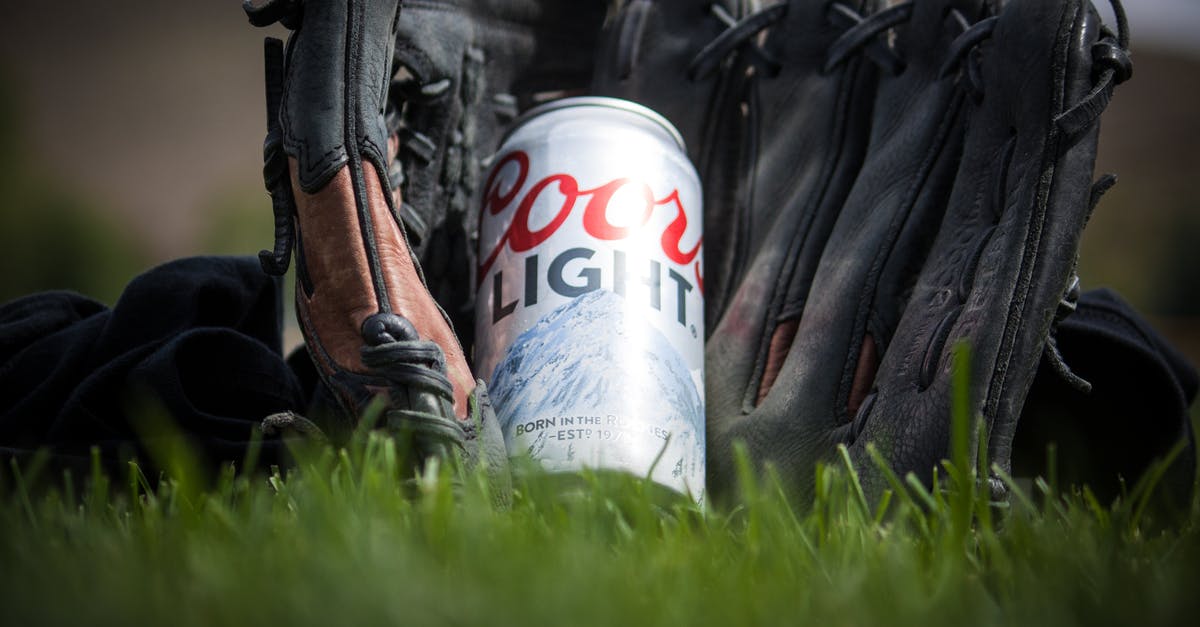 How can I identify a good beer garden in Munich (Germany)? [closed] - Close Up Photography of Coors Light Beer Near Black Baseball Mitts
