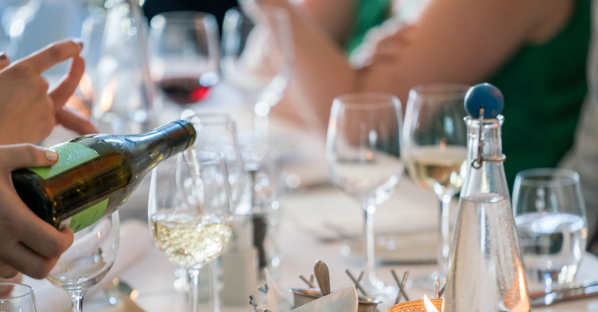 How can I make a wedding toast in Spanish (1 sentence)? [closed] - Person Pouring Wine on Clear Wine Glass
