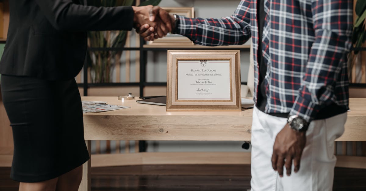 How can I make sure it's legal to "help" in return for lodging on a non-working visa somewhere? [closed] - A Lawyer and a Client Shaking Hands
