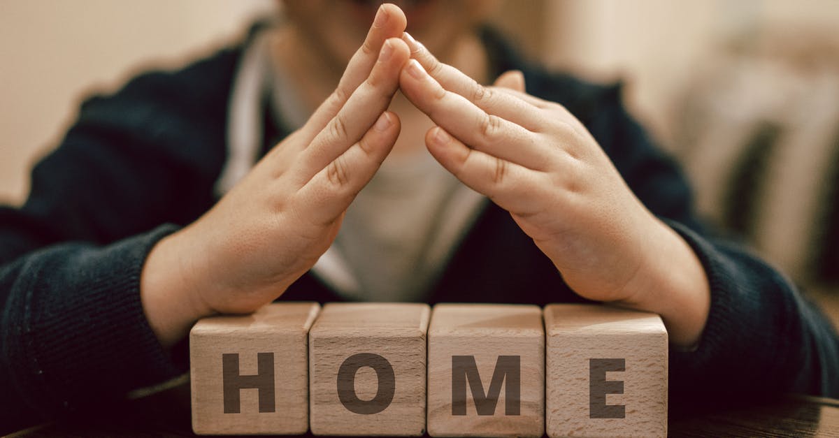 How can I open and reset the combination lock on my suitcase, I have forgotten the combination [duplicate] - Boy making roof hands under wooden cubes