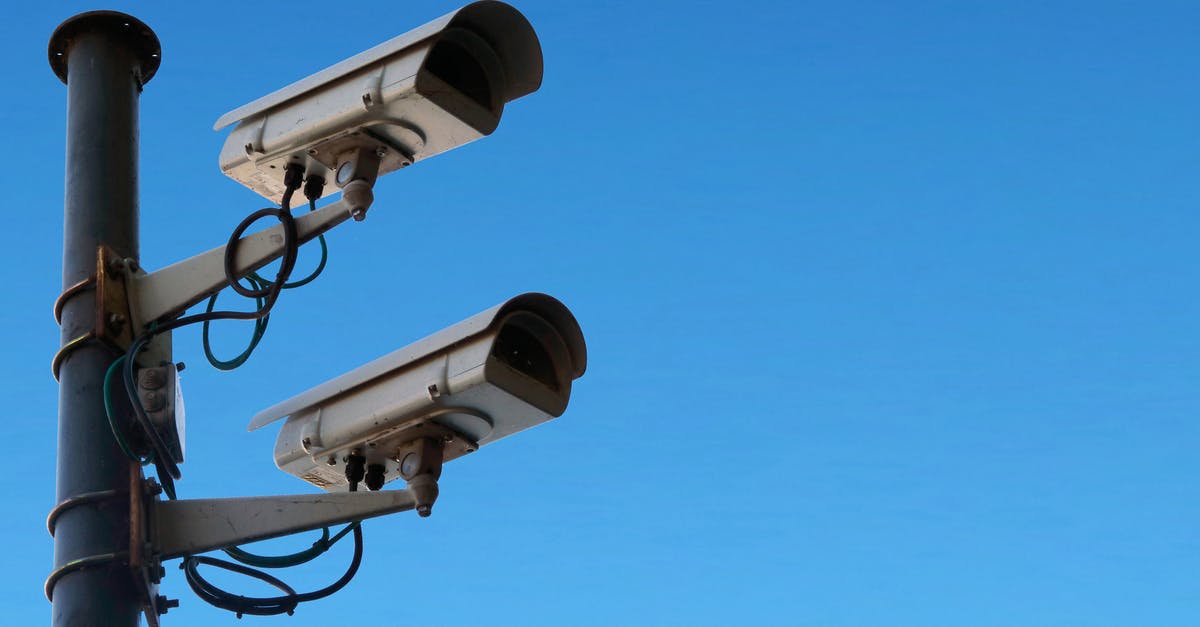 How can I protect camera equipment in checked baggage? - Surveillance cameras against blue sky How can I protect camera equipment in checked baggage? - Surveillance cameras against blue sky