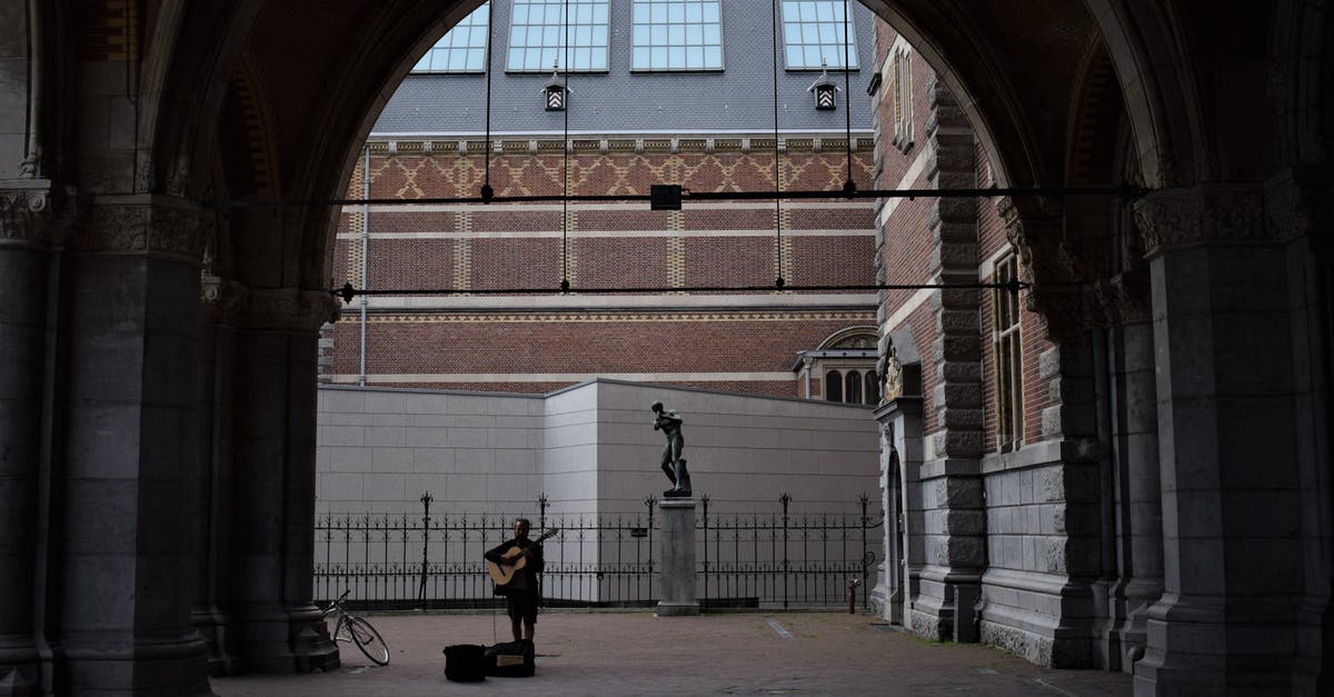 How can I reach Muiderslot castle from Amsterdam Central? - Person Playing Guitar on Street How can I reach Muiderslot castle from Amsterdam Central? - Person Playing Guitar on Street