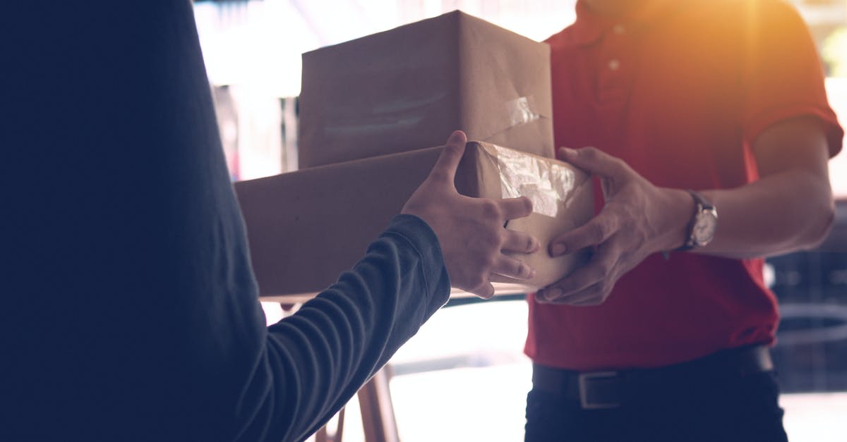 How can I receive packages while in France? - Man Delivering Packages To A Person How can I receive packages while in France? - Man Delivering Packages To A Person