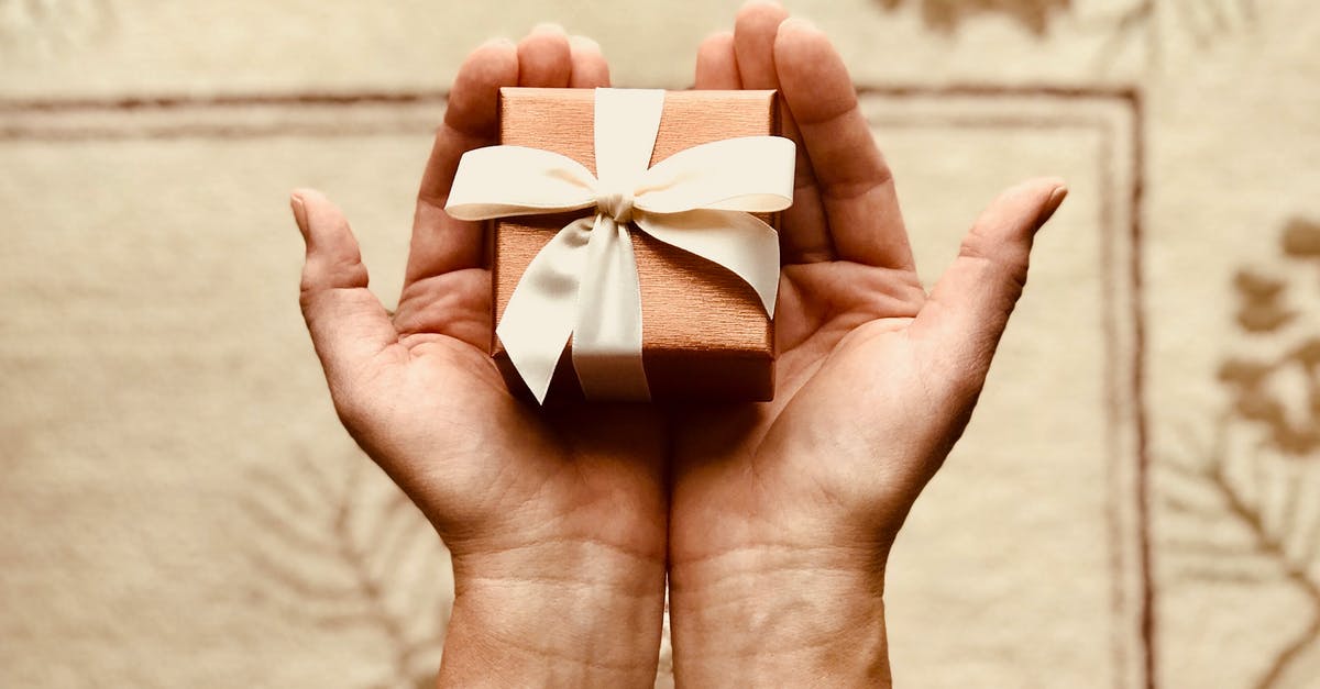 How can I receive packages while in France? - Person's Holds Brown Gift Box How can I receive packages while in France? - Person's Holds Brown Gift Box