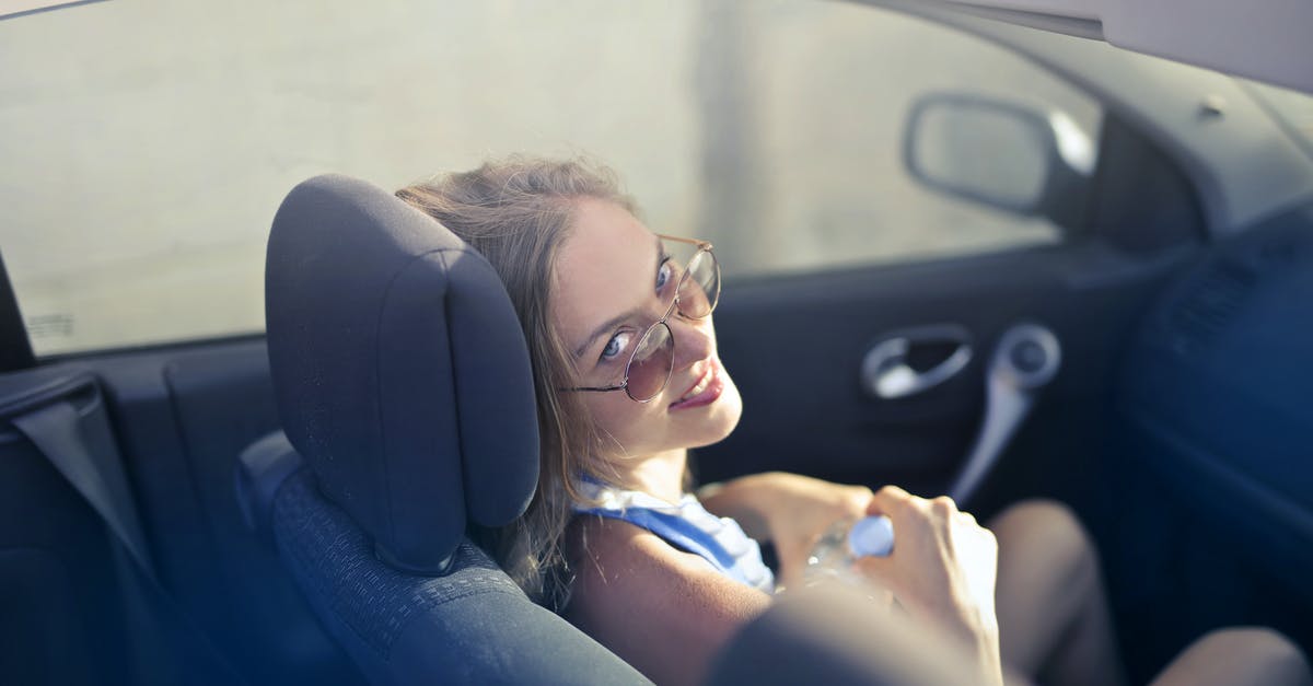 How can I remove highway vignettes and other miscellaneous stickers from the windshield of my car? - Modern woman on passenger seat in convertible How can I remove highway vignettes and other miscellaneous stickers from the windshield of my car? - Modern woman on passenger seat in convertible