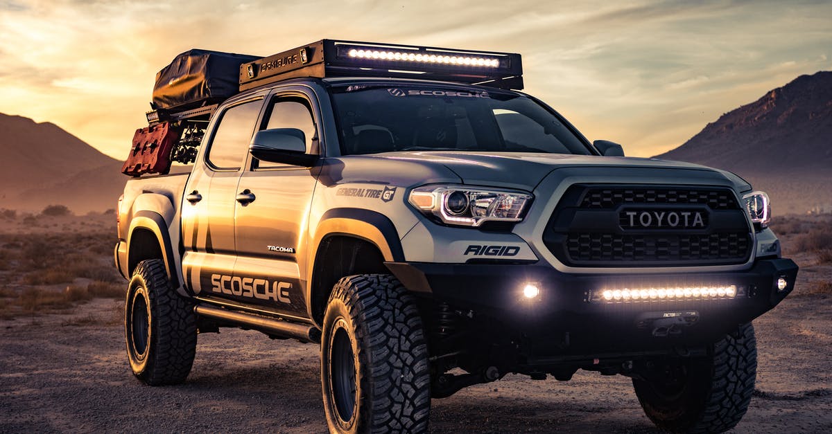How can I rent a car with (1) adaptive (2) HID/LED headlights? [closed] - Black Toyota 4-door Truck