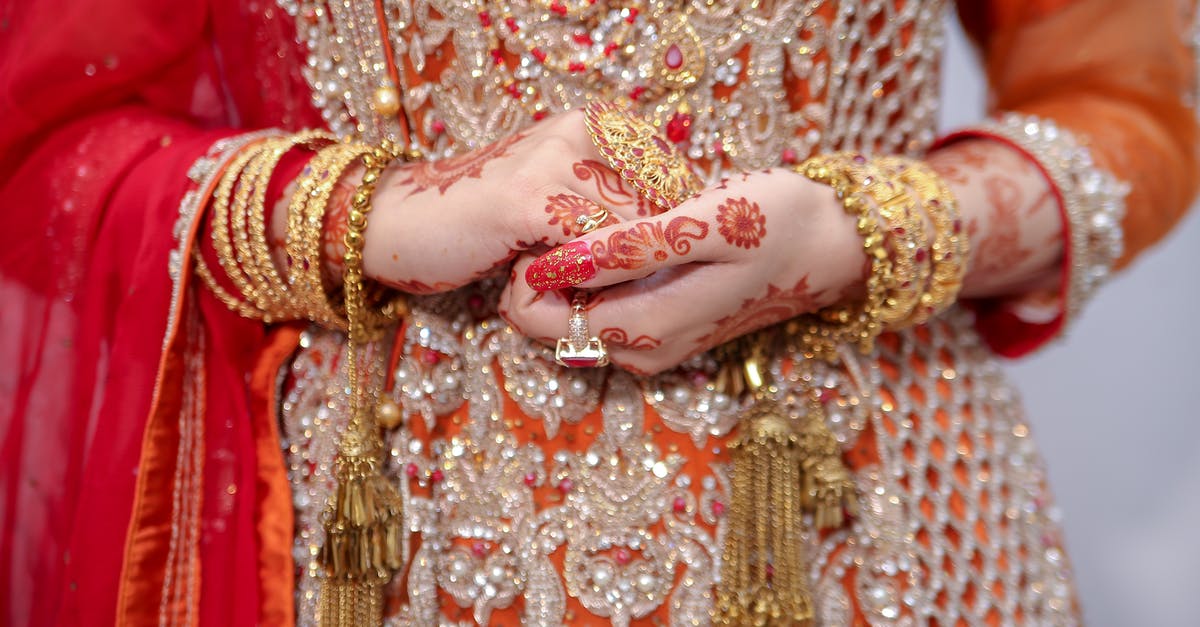 How can I replace an Indian passport while residing in USA? [closed] - Woman in Gold and Red Floral Dress