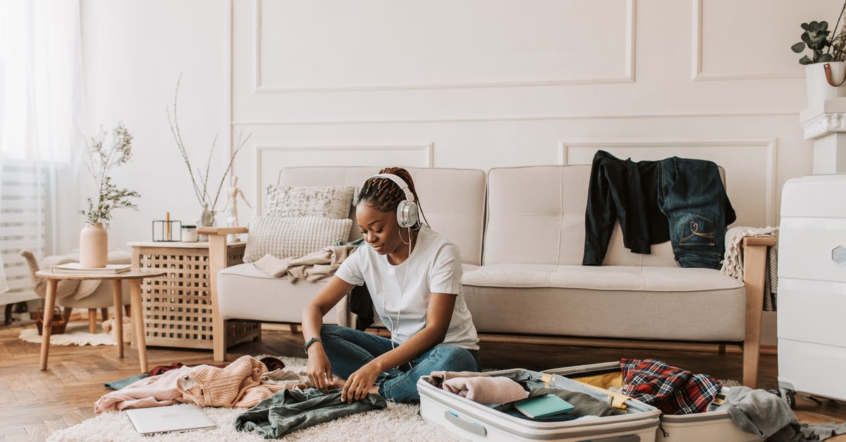 How can I safely pack a printer in checked baggage? - A Woman Packing Clothes in a Luggage How can I safely pack a printer in checked baggage? - A Woman Packing Clothes in a Luggage