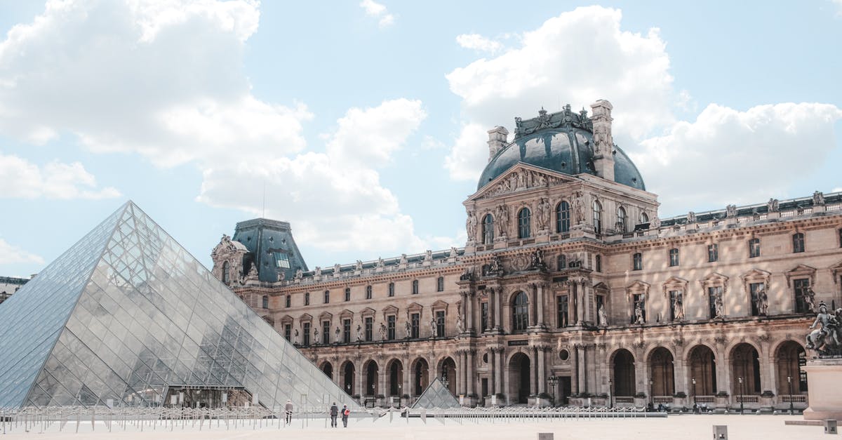 How can I stay in the center of Paris cheaper than AirBnB? [closed] - Scenery of landmark glass Pyramid on Louvre Museum square