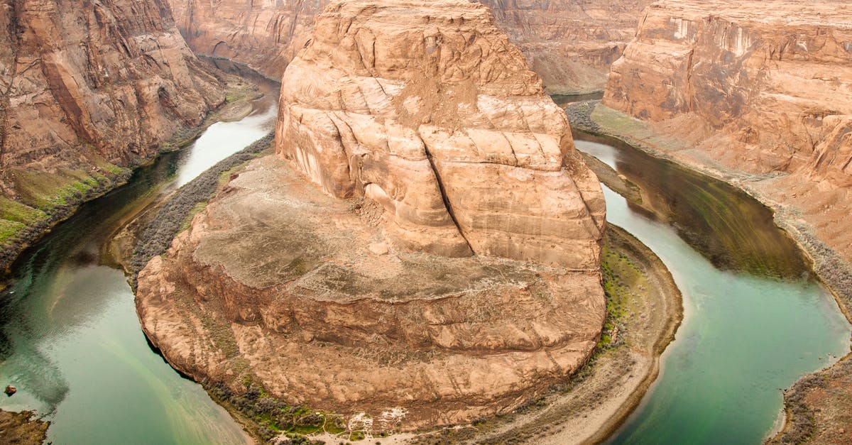 How can I travel outside the US after naturalization while waiting for passport? - Picturesque view of rough rocky terrain of Horseshoe Canyon and calm green river flowing between rocky slopes in Canyonlands National Park in Utah How can I travel outside the US after naturalization while waiting for passport? - Picturesque view of rough rocky terrain of Horseshoe Canyon and calm green river flowing between rocky slopes in Canyonlands National Park in Utah