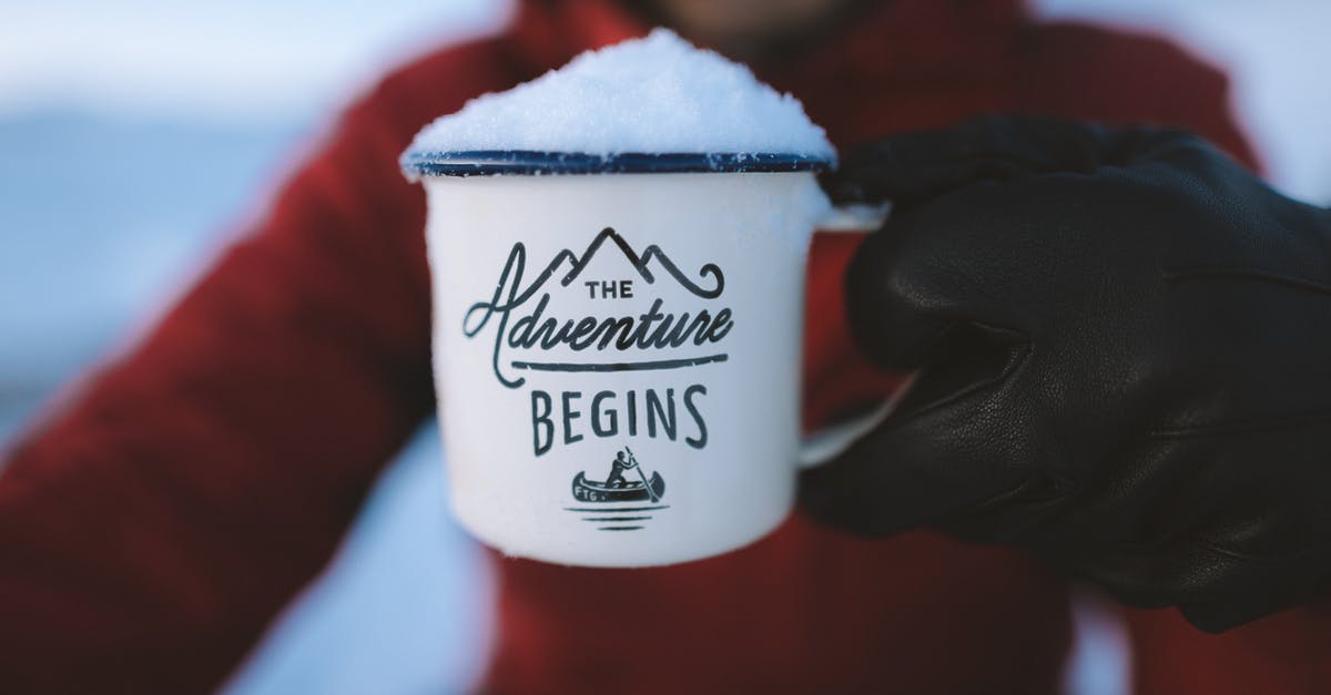 How can I travel to ICE or DHS headquarters? [closed] - Selective Focus Photography of Person Holding the Adventure Begins Mug