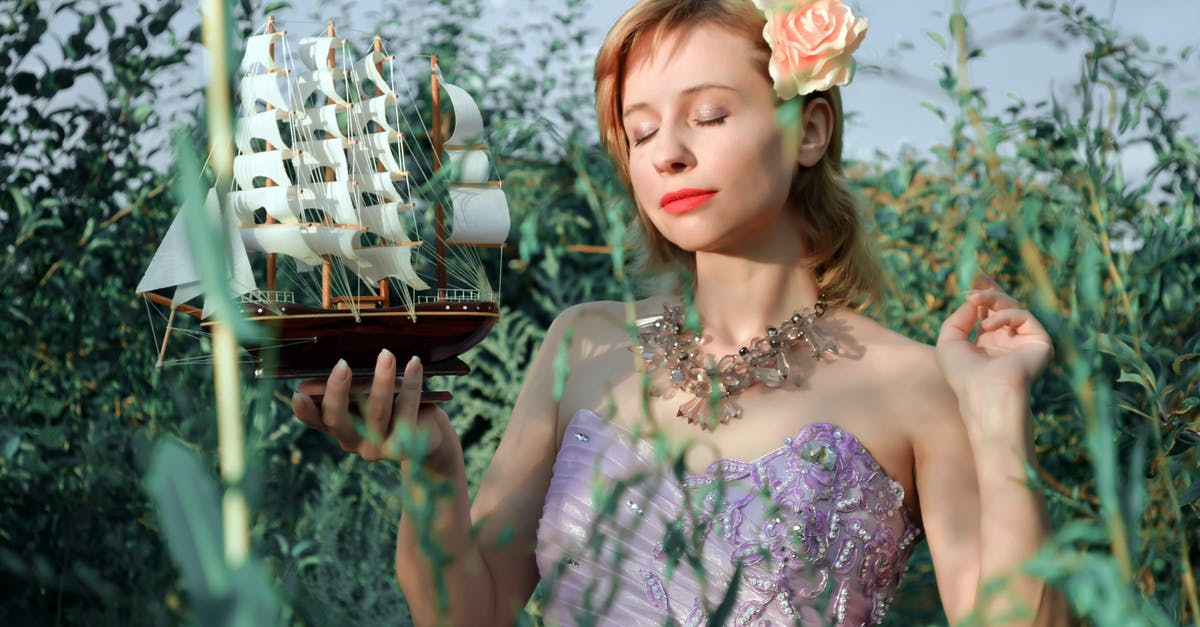 How can I travel to Mexico during the grace period at the end of my J-1 visa? [closed] - Young dreamy woman with closed eyes wearing elegant party outfit standing with small sail ship model in green garden