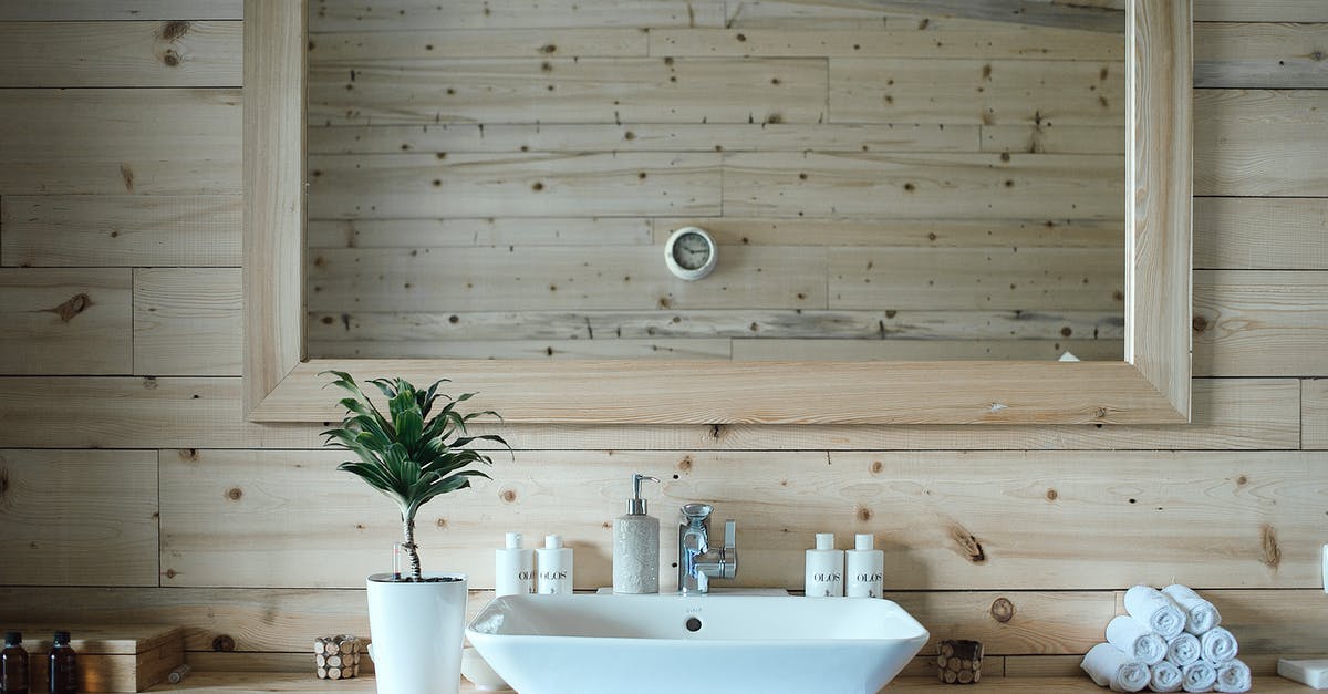 How can I wash myself Indian-style (using water not toilet paper) in Western toilets? - Stylish interior design of contemporary bathroom with wooden walls and big mirror above sink and table with toiletries How can I wash myself Indian-style (using water not toilet paper) in Western toilets? - Stylish interior design of contemporary bathroom with wooden walls and big mirror above sink and table with toiletries