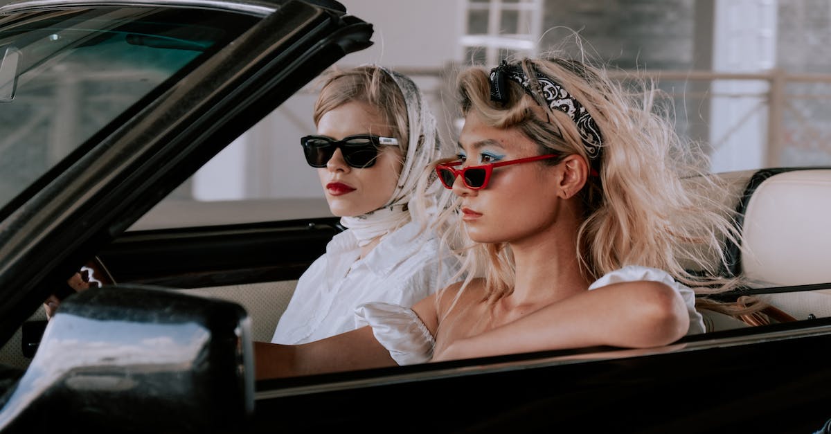 How can non-Caucasians avoid suspicious looks when traveling in the West? - Stylish Friends Traveling on a Cabriolet