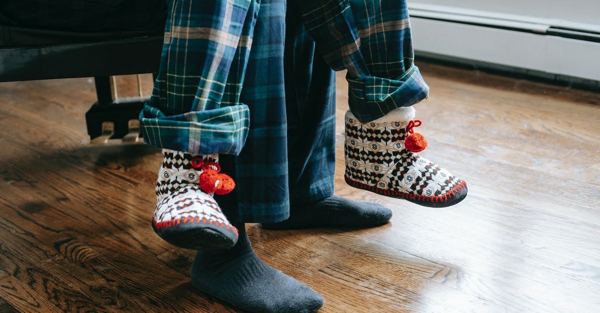 How come I see two ICE trains scheduled for the same platform at the same time? - Crop father and child wearing soft same pajamas sitting together at daylight at home