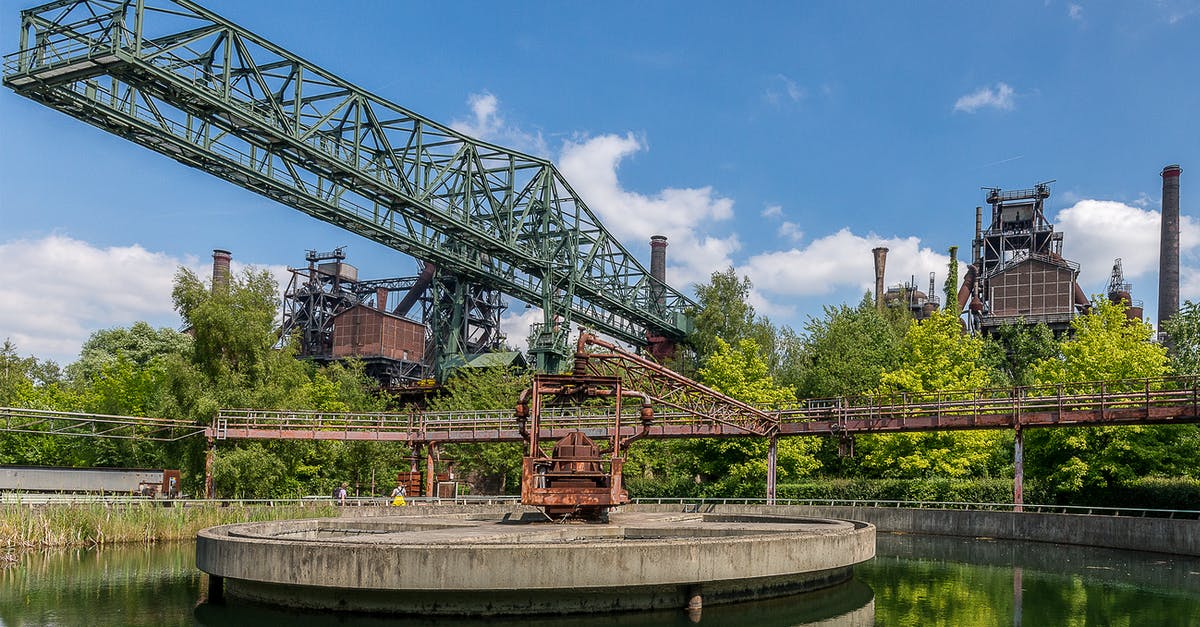 How common is it for large bridges or bridge-tunnel complexes to not have toll? [closed] - Red and Black Metal Crane Near Green Trees Under Blue Sky