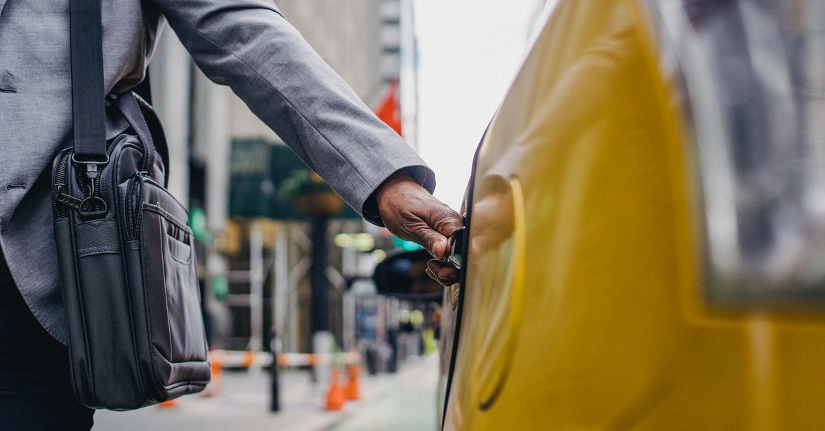 How could a Washington registered car travel to Zürich? - Black man touching door of taxi How could a Washington registered car travel to Zürich? - Black man touching door of taxi