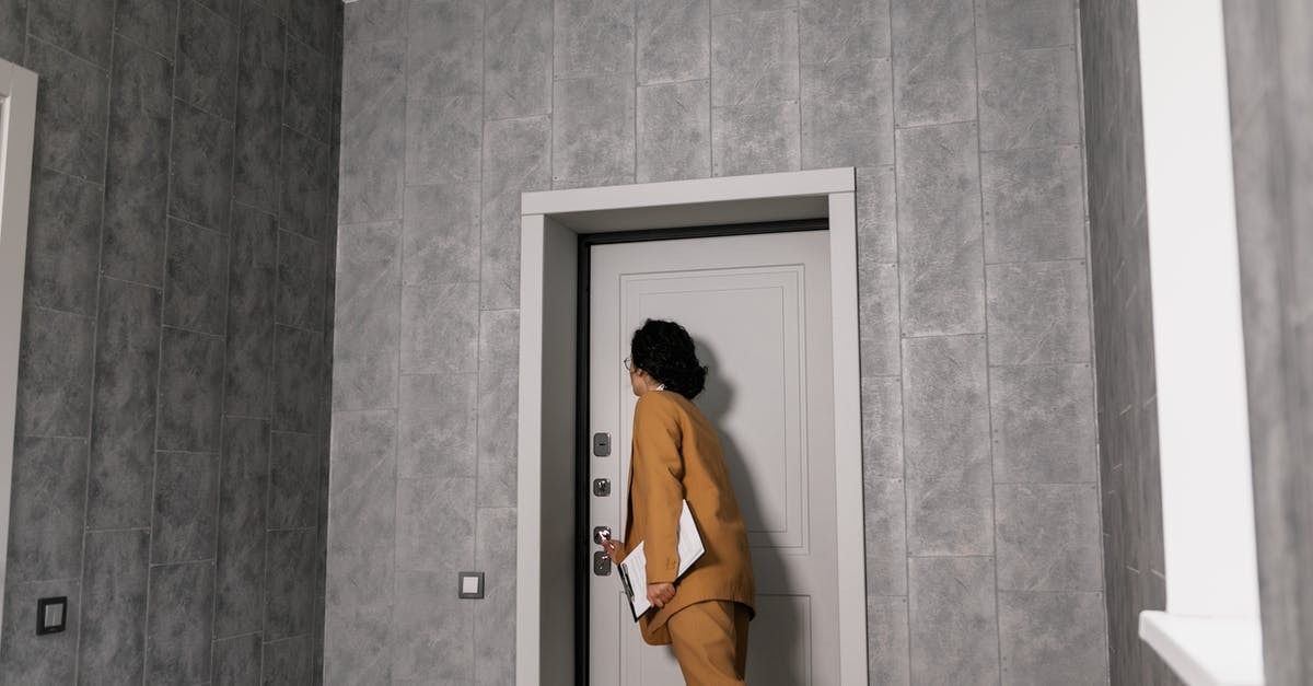 How do door locks work in South America? - Woman in Brown Coat and Brown Pants Standing in Front of Door How do door locks work in South America? - Woman in Brown Coat and Brown Pants Standing in Front of Door