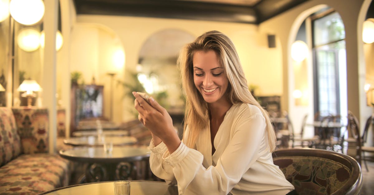 How do hotel housekeepers know if a room is in use? - Cheerful female having drink in elegant bar How do hotel housekeepers know if a room is in use? - Cheerful female having drink in elegant bar
