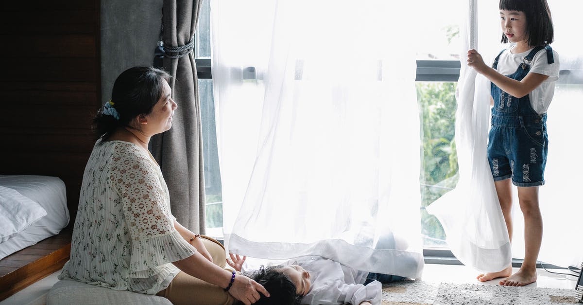 How do I apply for a visa for my elder sister to care for me after my surgery? [duplicate] - Full body of aged woman caressing grandson while communicating with little girl in cozy room