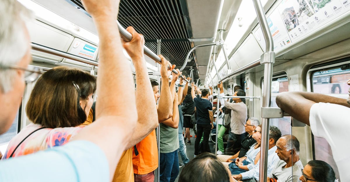 How do I complete the passenger locator form EU for arrival when transiting through Geneva? - Metro train full of people during busy day