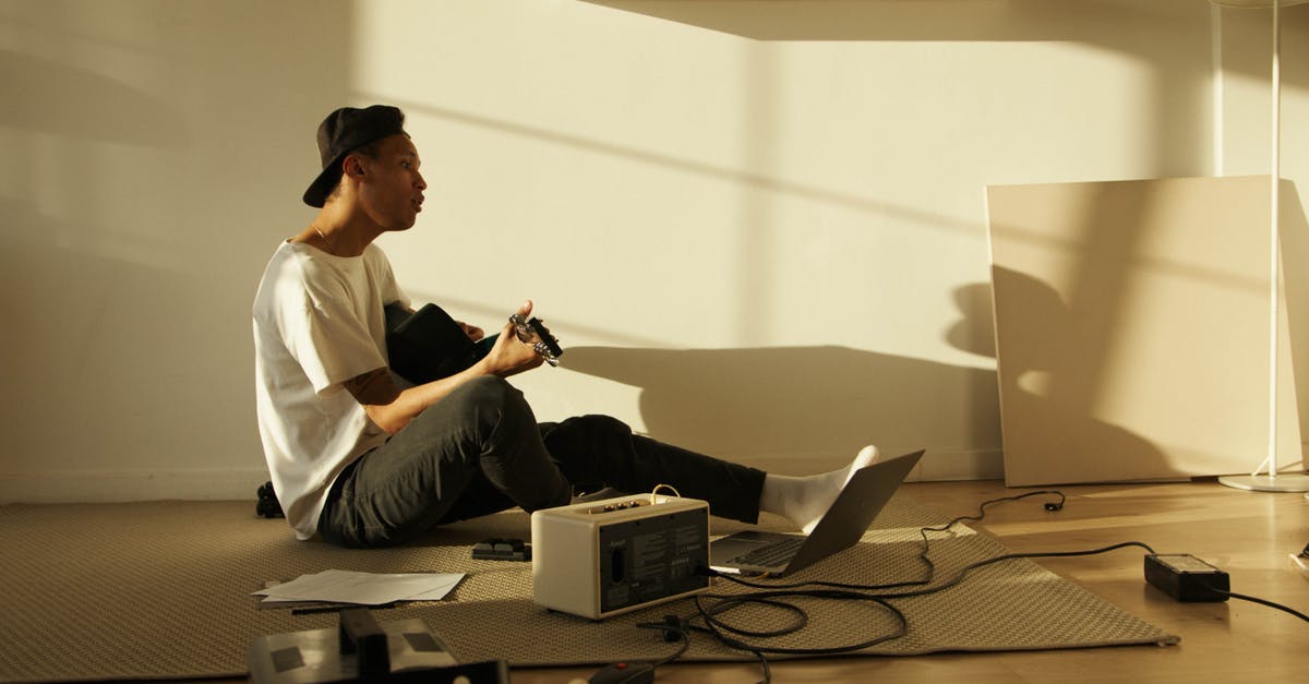How do I get back to the UK if my country is in the COVID "banned countries" list? (Tier 2 Work visa) - Man in White Button Up Shirt and Black Pants Sitting on Brown Sofa How do I get back to the UK if my country is in the COVID "banned countries" list? (Tier 2 Work visa) - Man in White Button Up Shirt and Black Pants Sitting on Brown Sofa