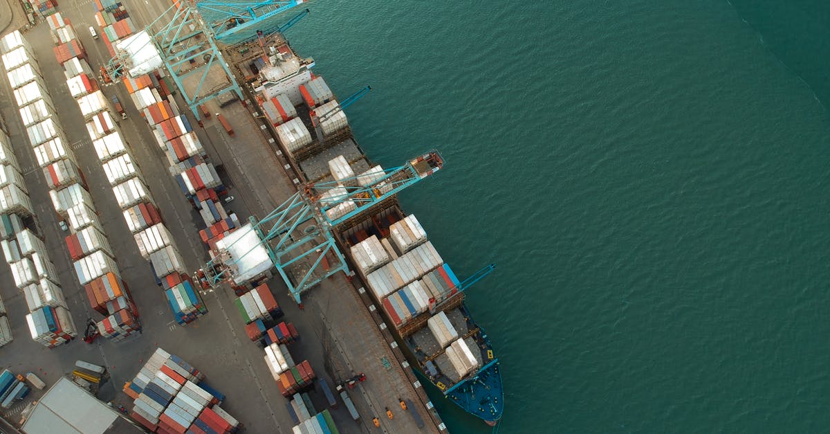 How do I get from Cairo Airport to Port Said with 2 large 20kg bags? - Top view of harbor with containers and cargo ships located near calm rippling sea water How do I get from Cairo Airport to Port Said with 2 large 20kg bags? - Top view of harbor with containers and cargo ships located near calm rippling sea water