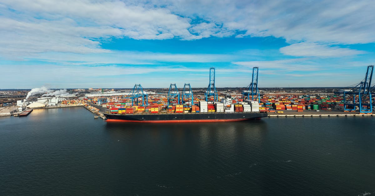 How do I get from Cairo Airport to Port Said with 2 large 20kg bags? - High angle of cargo ship moored in modern industrial port under blue cloudy sky in daylight How do I get from Cairo Airport to Port Said with 2 large 20kg bags? - High angle of cargo ship moored in modern industrial port under blue cloudy sky in daylight