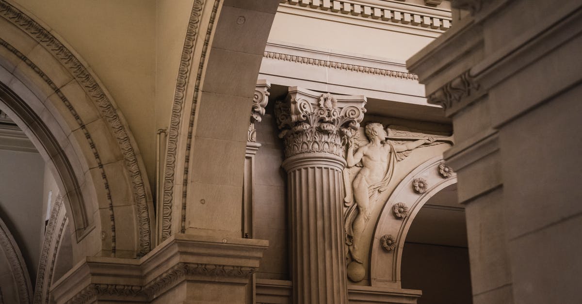 How do I get past a 3-year ban from overstay with VWP? [duplicate] - From below of aged stone arch with columns and stucco decorations on wall of ancient building