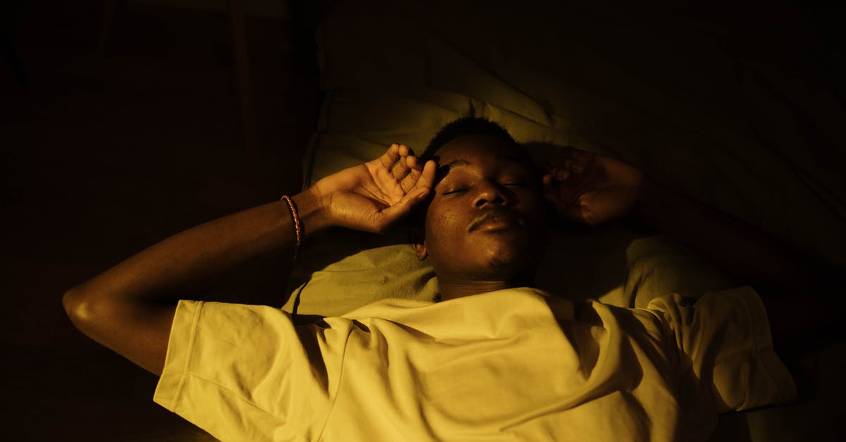 How do I purchase tickets for the Night Riviera sleeping compartment? - Warm Light Shining on the Man Lying on the Bed