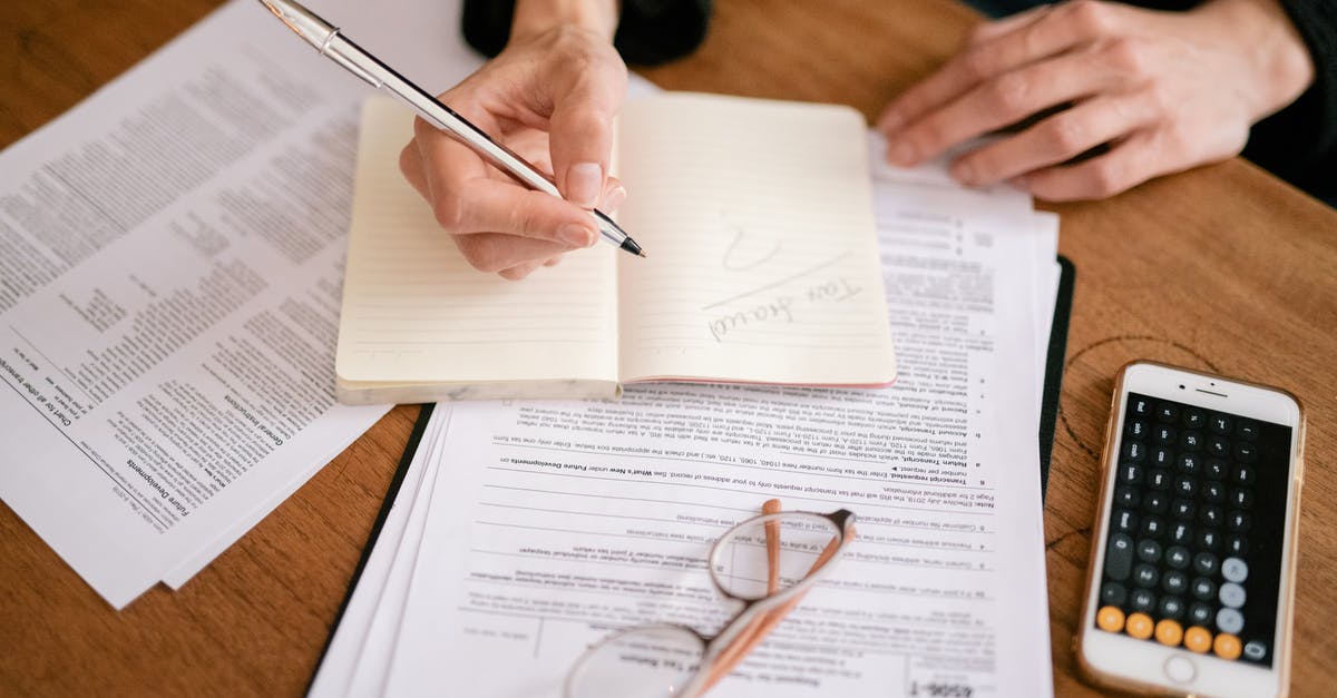 How do I recognize a scam website? - Person Writing on White Paper How do I recognize a scam website? - Person Writing on White Paper