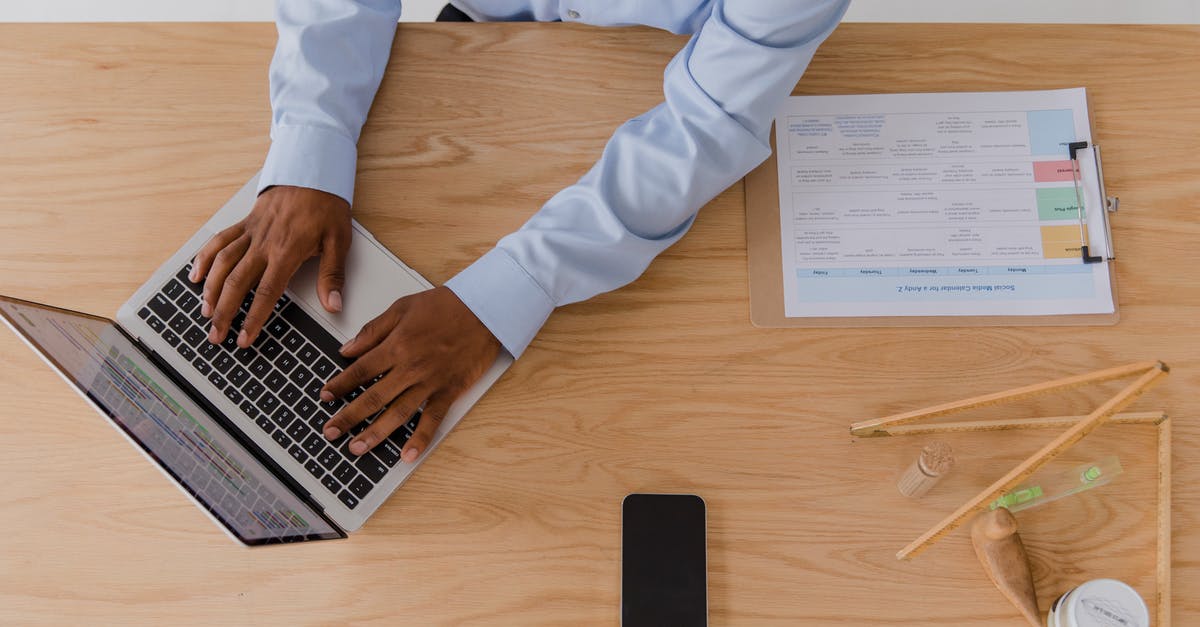 How do North Americans use toilet paper? [closed] - Man Using Laptop while Sitting at Desk