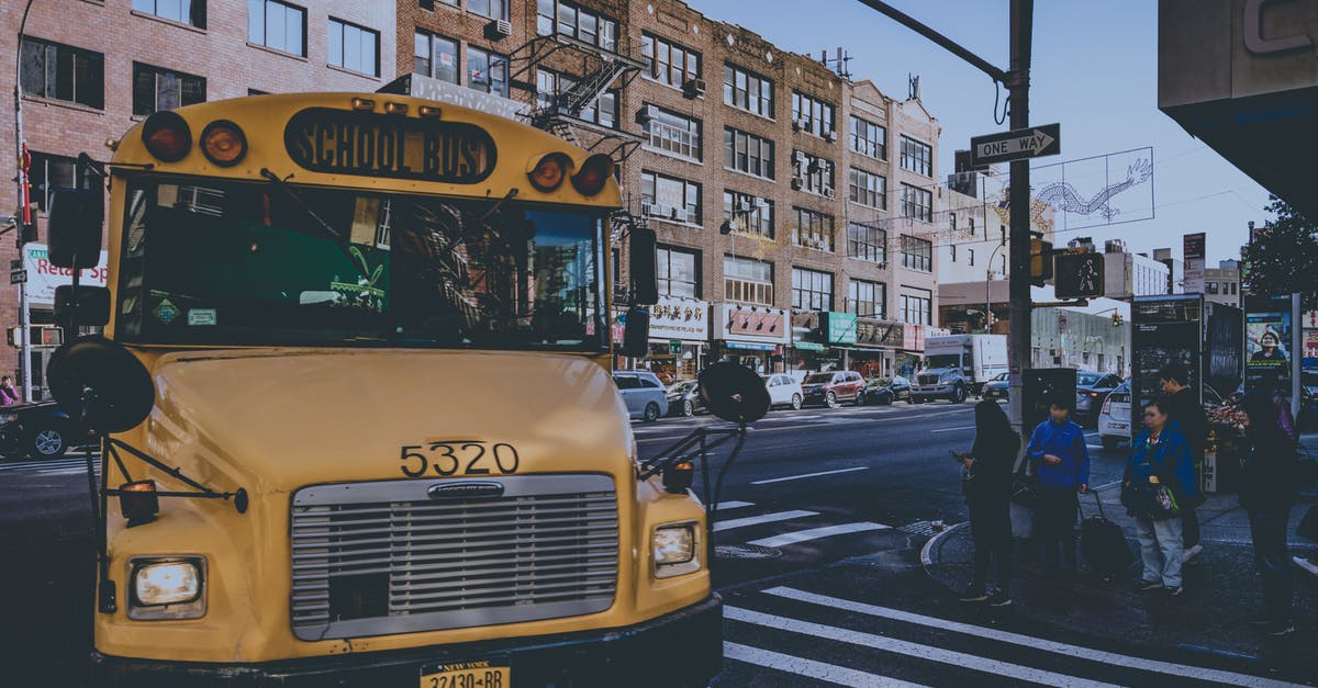 How do Quebec city bus tickets work? - Yellow Bus on Street How do Quebec city bus tickets work? - Yellow Bus on Street