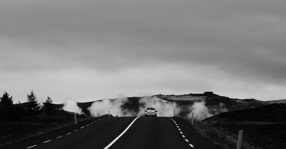 How do the Express Lanes in California know how many occupants a car using the express lane contains? - Monochrome Photo Of Road 