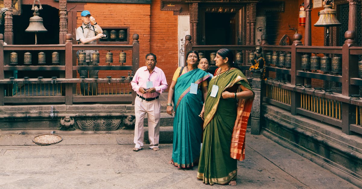How do western people perceive Indians worshipping cows in Hindu temples? [closed] - Woman wearing Traditional Sari in a Temple 