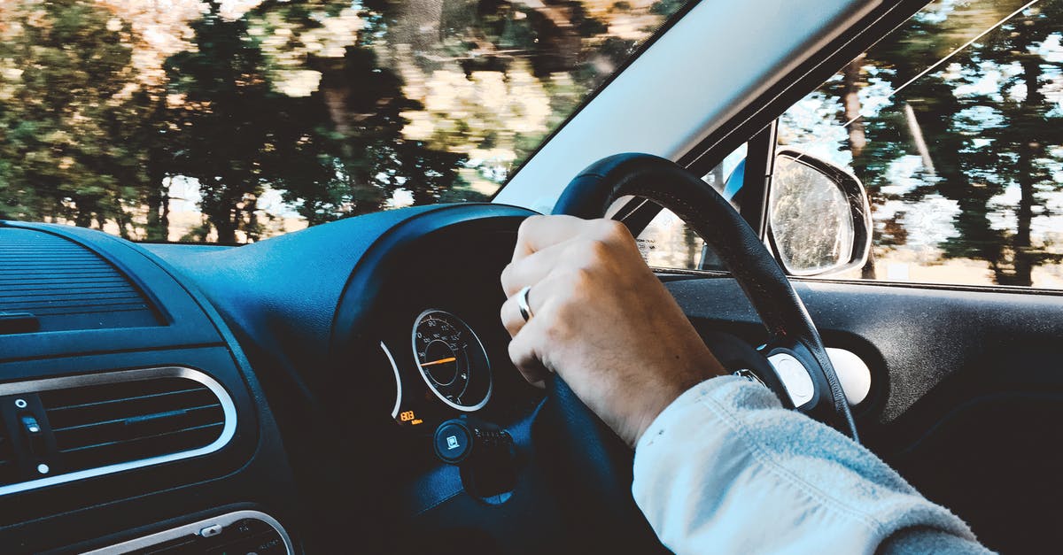 How do you drive a British car? Is it with the left hand and foot or right? [duplicate] - Person Holding Black Vehicle Steering Wheel