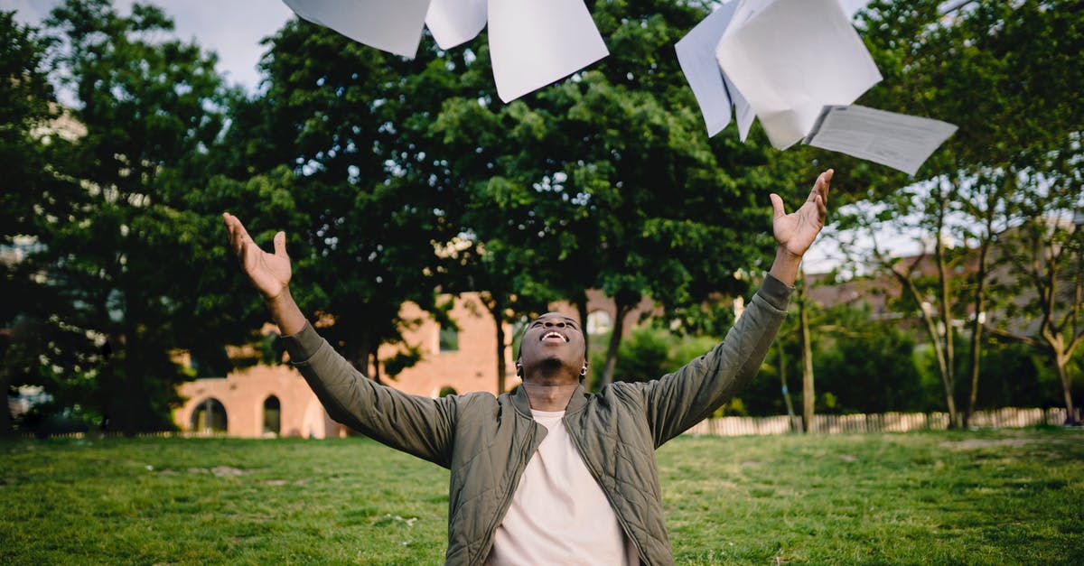How do you get air miles? - Happy young African American male student in casual outfit tossing university papers in air while having fun in green park after successfully completing academic assignments How do you get air miles? - Happy young African American male student in casual outfit tossing university papers in air while having fun in green park after successfully completing academic assignments