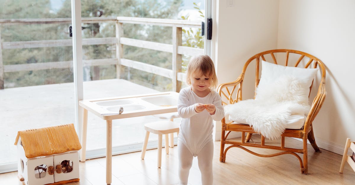 How do you seat a baby securely on a coach transfer? - Girl Playing In The Living Room How do you seat a baby securely on a coach transfer? - Girl Playing In The Living Room