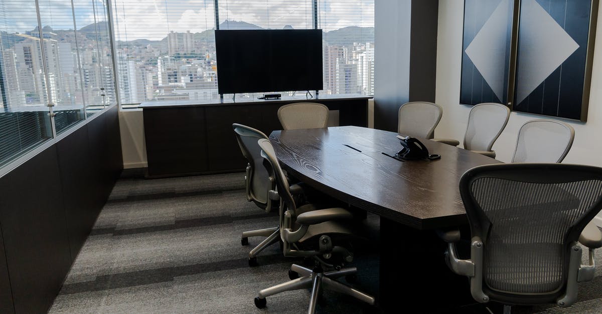 How does an airline/ground handling company send a notification to Russian authorities? - Interior of contemporary conference room with long table