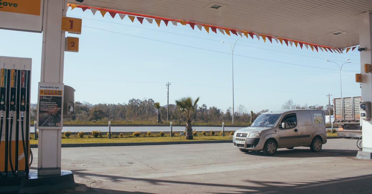 How does one know if a rental car takes diesel or gasoline? - Car near gas station against cloudless sky How does one know if a rental car takes diesel or gasoline? - Car near gas station against cloudless sky